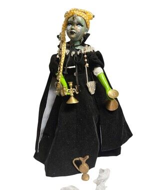 custom-designed porcelain Bohemian witch doll featuring vintage jewelry